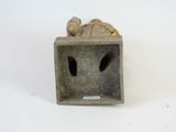 a figurine of a man and a woman in a box