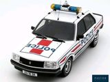 a white police car with a red and blue light on top