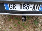 a cat that is sitting on the back of a car