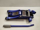 a blue jack sitting on top of a table next to a tool