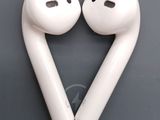 two white airpods sitting next to each other on top of a table