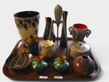 a tray with many different vases on it