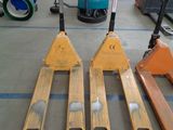 four skis that are sitting on the floor in a warehouse