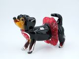 a black and red dog figurine with a tutu skirt