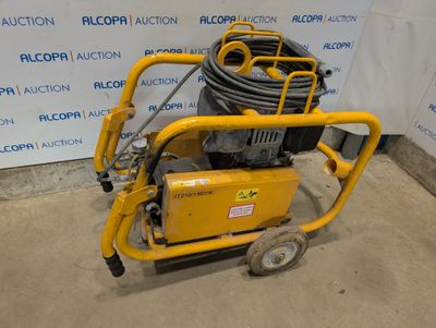 une image représentant une machine jaune surmontée d'un tuyau