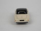 a toy car that is sitting on a white surface