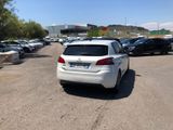 a white car that is parked in a parking lot
