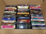 a lot of dvds in a box on the floor