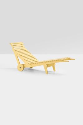 a wooden chaise lounger with wheels on a white surface