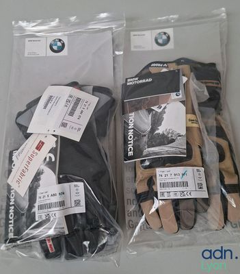 two pairs of gloves and a pair of gloves in a bag