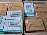 several boxes of electronic devices are stacked on top of each other