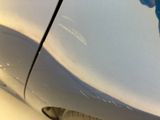 a close up of a car ' s paint job on the side of the car