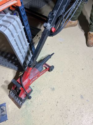 a toy crane that is sitting on the floor