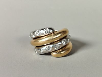 an image of a gold and silver ring with diamonds