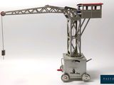 a toy crane that is sitting on top of a cart