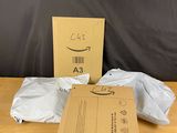 a cardboard box and a package on a wooden table