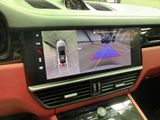 the interior of a car with a view of a car ' s rear view camera