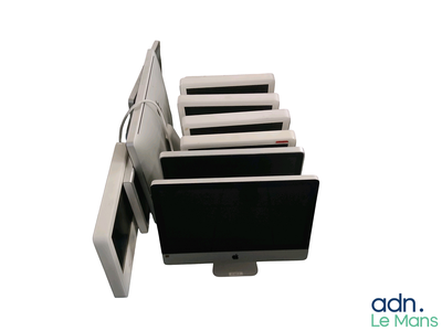 a computer monitor with a bunch of books on top of it