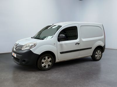 the white van is parked in a white room with a black stripe