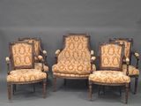 three antique chairs with upholstered arms and a gold and white upholstered back