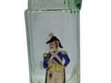 a green glass vase with a picture of a man on it
