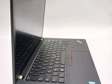 a laptop with a black keyboard on a white surface