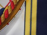 a close up of a tie with a design on it