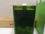a green box and a green box on a white table