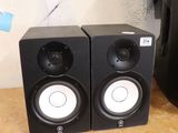 two speakers that are sitting on a counter