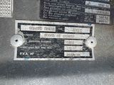 a close up of a metal plate with a sign on it