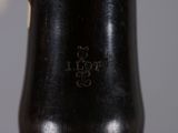 a close up of a black vase on a table