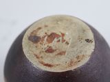 a close up of a vase with a smiley face on it