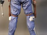 sides view of a figurine of a man holding a baseball bat