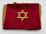 a red velvet pouch with a gold star of david on it