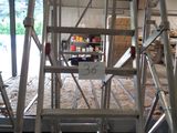 a picture of a ladder in a building with a sign on it