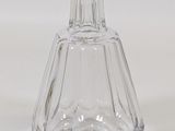 a clear glass bottle that is sitting on a white surface