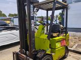 a forklift parked in front of a building