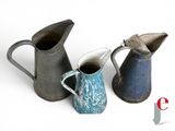 three different types of jugs sitting next to each other