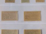 four different types of stamps are on display in a display case