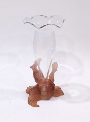 a glass vase with a fish inside of it on a table