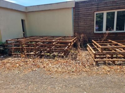 a lot of wooden structures in front of a building