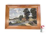 une peinture à l'huile représentant un pont au-dessus d'une rivière, dans un cadre en bois