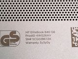 a close up of the back of a laptop with a qr code on it