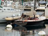 a small boat that is docked in the water