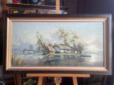 a picture of a painting on a easel in a room