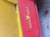 a yellow and red toy truck with a yellow wheel