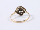 an antique gold ring with a flower design