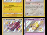 four different pokemon cards with different designs on them on a black background
