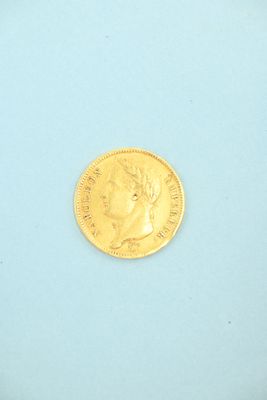an image of a gold coin on a blue surface