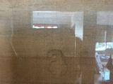 a reflection of a person in a mirror in a room